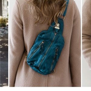 Luther, Crossbody bag, Teal, has a little water stain, in great condition.